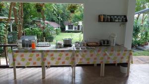a table with a table cloth with food on it at Niche Khaoyai in Ban Tha Maprang