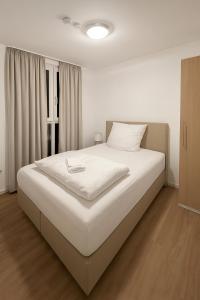 Postel nebo postele na pokoji v ubytování Work & Travel Lodge Münsingen