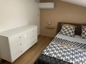 Ένα ή περισσότερα κρεβάτια σε δωμάτιο στο Appartement dans le quartier de terre sainte elona