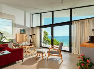 a living room with a view of the ocean at Villa Katina in Sućuraj