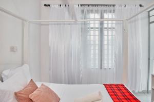 Ένα ή περισσότερα κρεβάτια σε δωμάτιο στο Swara house