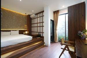 Postel nebo postele na pokoji v ubytování Nana Villa Hue