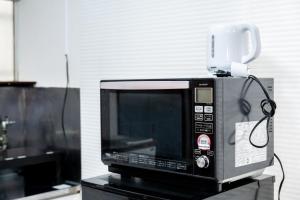 Μια τηλεόραση ή/και κέντρο ψυχαγωγίας στο StayMaster House