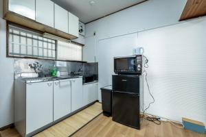 Η κουζίνα ή μικρή κουζίνα στο StayMaster House