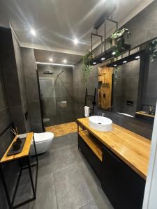 Ванная комната в Love Loft Olimpia Port - Apartament 2-pokojowy