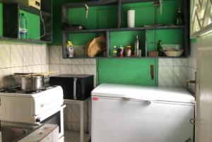 Kuchyň nebo kuchyňský kout v ubytování Ikirunga Art Center