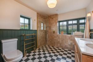 a bathroom with a toilet and a sink at Merryweather in Canterbury +36 photos