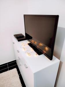 a white dresser with a mirror on top of it at Tara Mountain House in Bajina Bašta