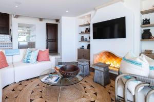 a living room with a couch and a table at Casa Sirena in San José del Cabo