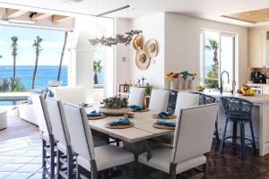 a kitchen and dining room with a table and chairs at Casa Sirena in San José del Cabo +16 photos