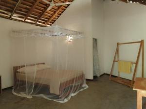 Un pat sau paturi într-o cameră la Open Cabana - Tangalle +19 fotografii