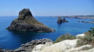a view of the ocean with rocks in the water at Garibaldi guest house in Catania