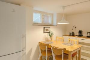 Kuchyň nebo kuchyňský kout v ubytování Villa Room