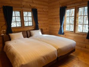 Ένα ή περισσότερα κρεβάτια σε δωμάτιο στο Le Mistral Hakuba +5 φωτογραφίες