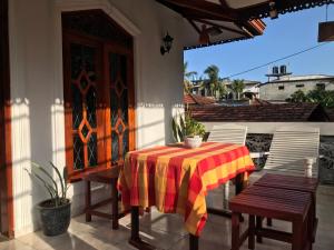 a table and two chairs on a patio at Dream Villa in Batigama