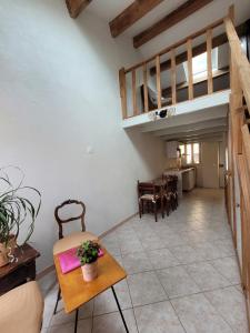 a living room with a couch and a table at Sanceflo in Mandelieu-La Napoule