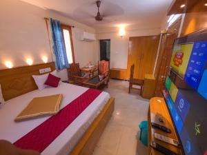 TV a/nebo společenská místnost v ubytování Velu Residency + 32 fotografií