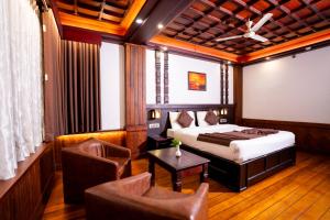 Un pat sau paturi într-o cameră la HillView Munnar +134 fotografii