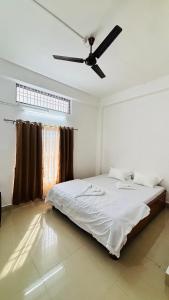 Ένα ή περισσότερα κρεβάτια σε δωμάτιο στο Toncheng Homestay