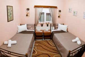 Ένα ή περισσότερα κρεβάτια σε δωμάτιο στο Katherine Home