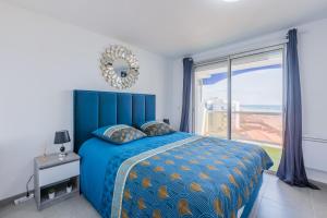 Ένα ή περισσότερα κρεβάτια σε δωμάτιο στο Le Prestigieux Accès direct Port et Plage