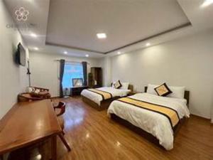 Giường trong phòng chung tại rubyhotel