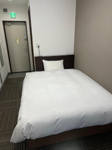 Postel nebo postele na pokoji v ubytování 未来ホテル MiraiHotel