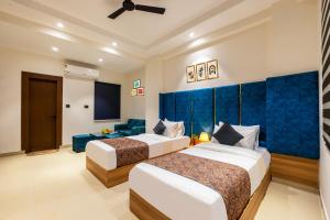 Ένα ή περισσότερα κρεβάτια σε δωμάτιο στο Noida business suites 141