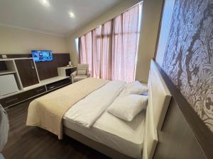 Ένα ή περισσότερα κρεβάτια σε δωμάτιο στο Travel Inn Bakuriani