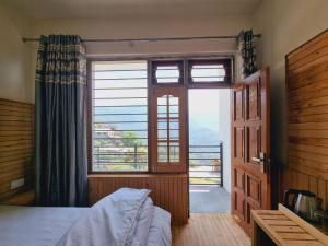 Ένα ή περισσότερα κρεβάτια σε δωμάτιο στο The Frost Heaven - Dalhousie +41 φωτογραφίες