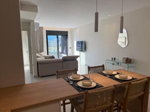 a kitchen and dining room with a table and chairs at Sea View Nafplio Luxury Apartment in Nafplio