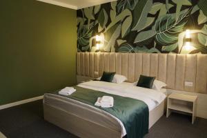 Postel nebo postele na pokoji v ubytování Гостиница БУРСА