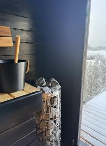 a corner of a room with a counter with a basket of rocks at Green Field Villa in Kuressaare