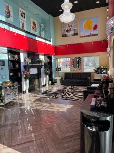 a lobby of a store with a fireplace at Coratel Inn and Suites By Jasper Wichita North in Wichita