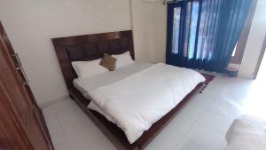 Un pat sau paturi într-o cameră la The Old Diary +4 fotografii