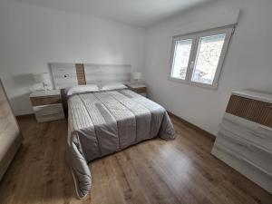 En eller flere senge i et værelse på Villa Las Norias