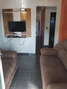 Μια τηλεόραση ή/και κέντρο ψυχαγωγίας στο Casa temporada RA capitolio