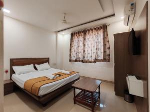 Ένα ή περισσότερα κρεβάτια σε δωμάτιο στο Sai Paradise lodging and Boarding +21 φωτογραφίες