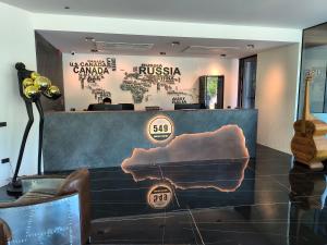 a store display with a guitar in a room at Khanom Station 549 in Ban Na Dan