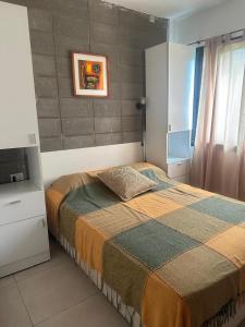 a bedroom with a bed and a television in it at HERMOSA CASA 2 DORMITORIOS EN POTRERO DE GARAY in Potrero de Garay