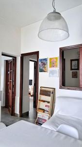 a bedroom with a bed and a pendant light at Casa Kolla - 2 bedrooms with private garage in downtown Salta in Salta