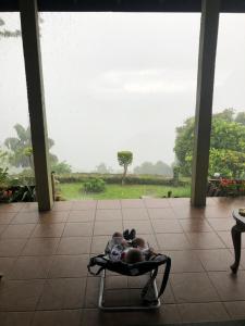 a person laying in a chair on a patio at Monaco Tangalle in Nikawatawana