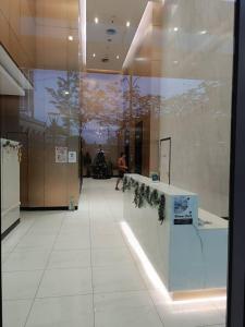 a hallway with a christmas tree in a building at The Luxe KLCC by Infinitum in Kuala Lumpur +111 photos