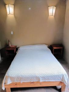 En eller flere senge i et værelse på Atelier del Monte + 2 billeder