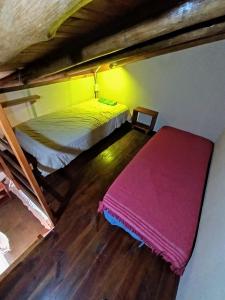 En eller flere senge i et værelse på Atelier del Monte