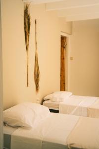 Postel nebo postele na pokoji v ubytování The Green Turtle Eco Lodge