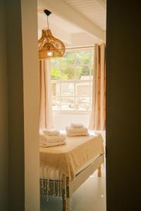 Postel nebo postele na pokoji v ubytování The Green Turtle Eco Lodge