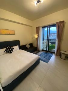 Postel nebo postele na pokoji v ubytování 青覓礁溪電梯民宿