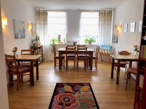 a dining room with a table and chairs at Alte Schmiede Putbus in Putbus