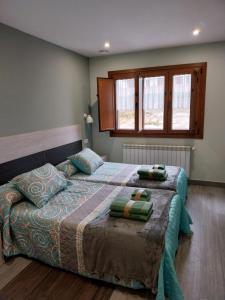Postel nebo postele na pokoji v ubytování El Rato Apartamentos Rurales